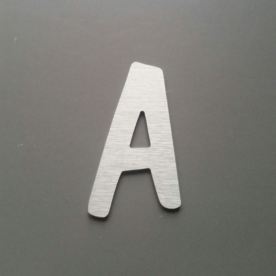 Brushed metal letter DOM CASUAL